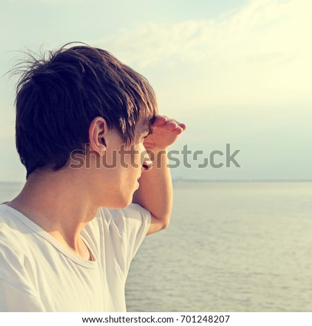 Toned Photo of Young Man at the Seaside