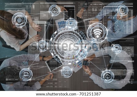 technology digital virtual screen and Wireless communication connecting over the Top view of Business People Group on a Meeting in the modern office, technology business internet of thing concept Royalty-Free Stock Photo #701251387