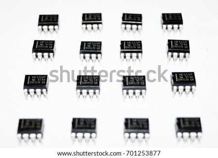Small computer chips in a row on a white background