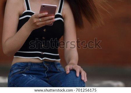 Woman using mobile phone on the street  travel and relax concept