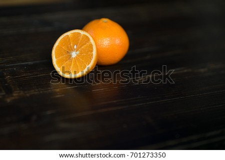 Closeup Orange fruit isolated on dark wooden table. Colorful of fresh fruits, healthy fruit on dark background. Royalty high quality free stock image.