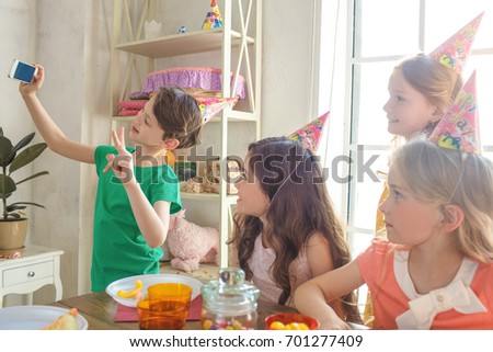 Little children celebrating birthday together at home