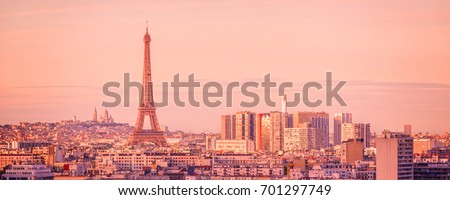 Panoramic skyline of Paris with the Eiffel tower at sunset, Montmartre in the background, France and Europe city travel concept