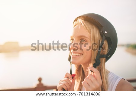 Woman is an extreme sport helmet