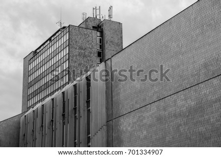 A picture of an old communist hotel. It is an illustration of the brutalist architecture of the past. 