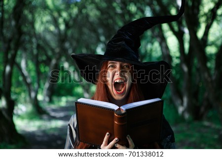 Portrait of young screaming witch