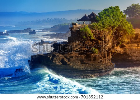 Tanah Lot Temple in Bali Island Indonesia. Royalty-Free Stock Photo #701352112