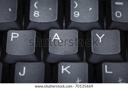 close up of word pay on computer keyboard