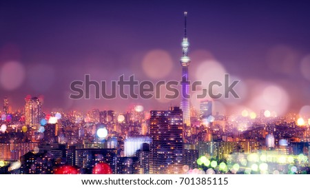 Nightlife in Tokyo. Tokyo Sky Tree with Blur Bokeh Lights Decoration in Colorful Filter. Tokyo Cityscape Background. Night sky and nightlife concept in Tokyo city.