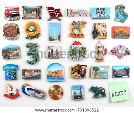 Many magnets on the refrigerator from the countries of the world - where to go? Royalty-Free Stock Photo #701398522