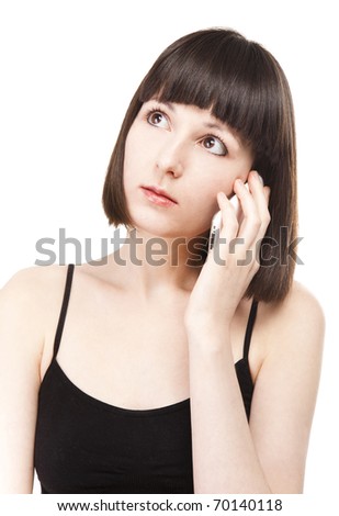 Portrait of a beautiful young brunette woman talking on a mobile phone