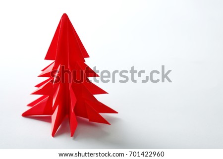 Christmas tree made of paper on white background