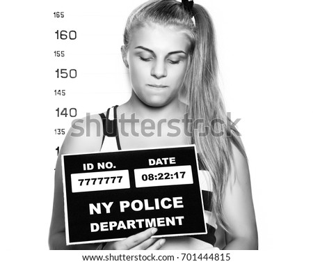 Young beautiful blonde woman Criminal Mug Shots. black and white
