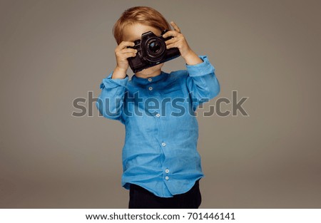 Boy holding a camera