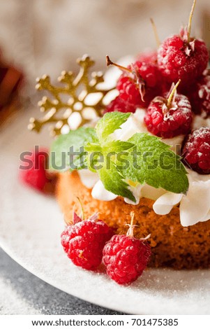 Raspberry Cake with whipped cream on pink background close up