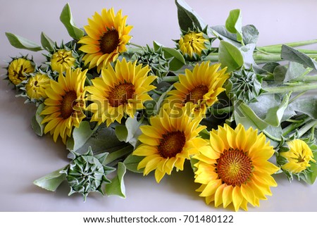 Amazing clay flower, handmade product for home decor, sunflower bouquet bloom in yellow and green leaf on white background, beautiful artificial flower