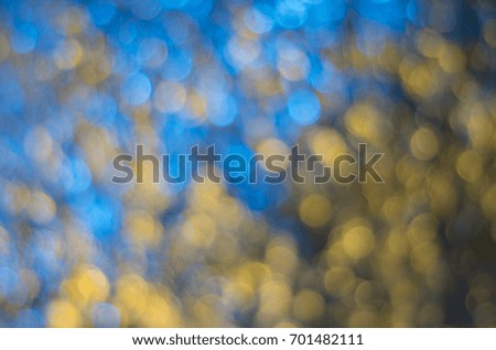 Abstract bokeh yellow-blue background.