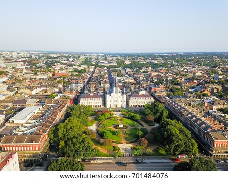 Aerial view of Jackson Square with Saint Louis Cathedral church and surrounding extant historical buildings from French Quarter in morning. The historic district section of the city of New Orleans.