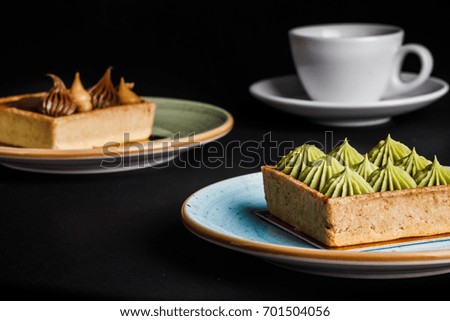 tasty cakes and tea  on table, close-up