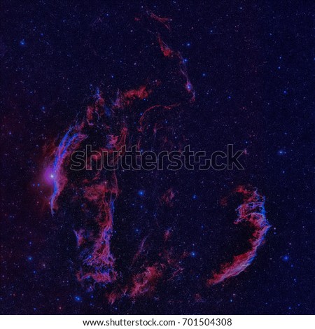 The Veil Nebula or NGC 6960 is a cloud of heated and ionized gas and dust in the constellation Cygnus. Retouched colored image. Elements of this image furnished by NASA.