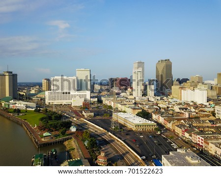 Aerial view Central Business District (CBD), a Mississippi riverside neighborhood of city New Orleans. Preserved 19th century French Quarter building in front of skyscrapers and modern office towers