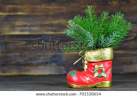 Christmas boot on wooden background with copy space	