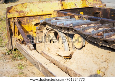 Fragment of tractor tracks. Radioactive dead zone of Chernobyl. Abandoned looted appliances, cars electronics in Chernobyl accident. Consequences of evacuation looting and vandalism after an explosion
