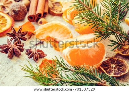 Christmas background with tangerines. Selective focus. 