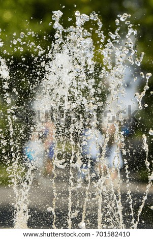 Jets of water fountain, blurry background, abstraction