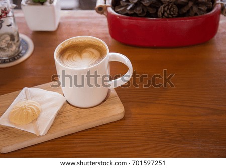 coffee cup and cookie on the wooden table-vintage style effect picture