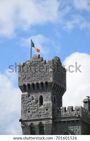 Irish flag flying on flagpole at Ashford Castle tower