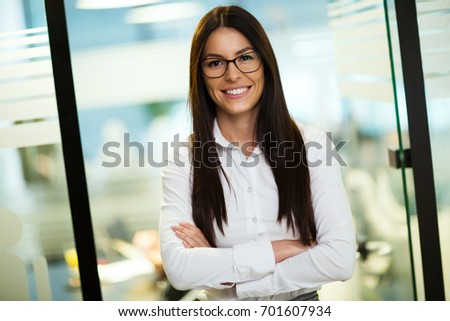 Portrait of young businesswoman posing in office
