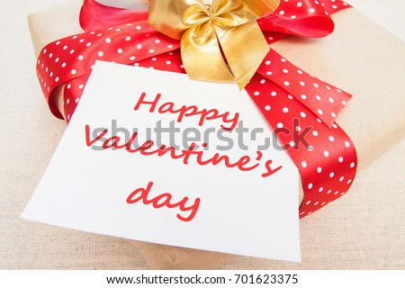 Blank, Valentine, greeting card with gift box, knitting loving couple, red ribbon Handmade concept.  Happy valentine's day