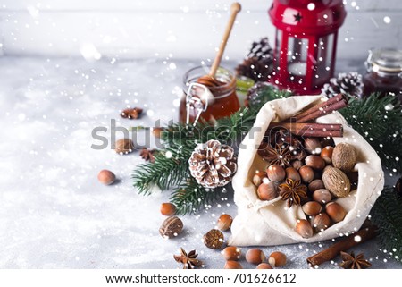 Fresh whole nuts and spices spilling