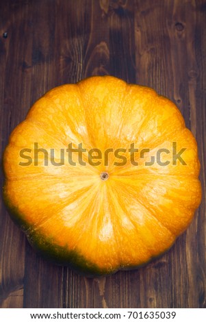 fresh pumpkin on wooden background