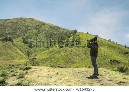 Young man asian photographers with  shoot photo nature