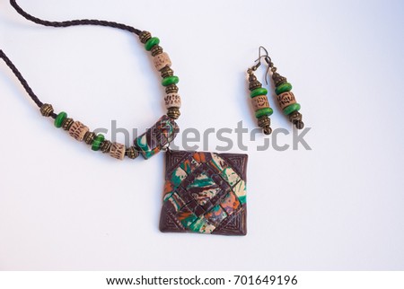 Mayan jewelry. Handmade jewelry set amulet and earrings. Ancient ethnic history symbol.