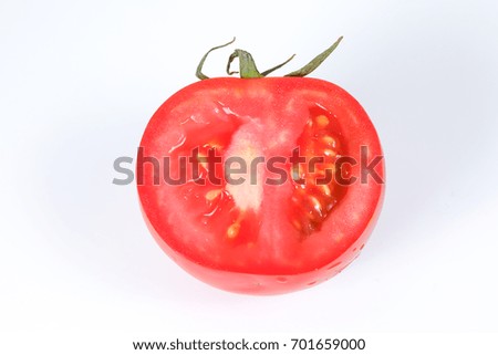 Tomato Fresh Red Ripe with green stem water splash 
