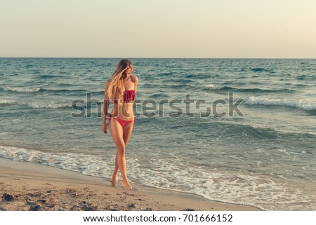 Beautiful girl at the sea posing