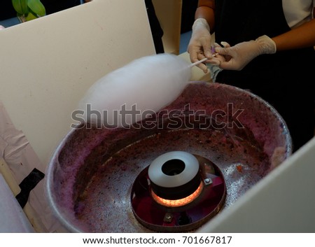 Doing cotton candy in candy floss machine