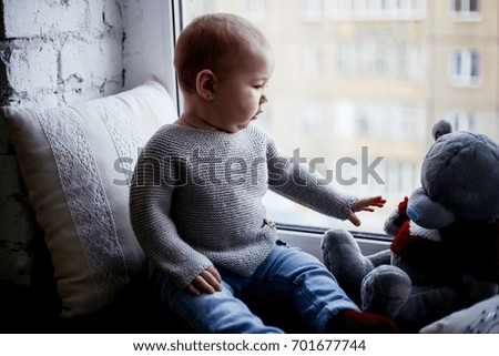 child at the window