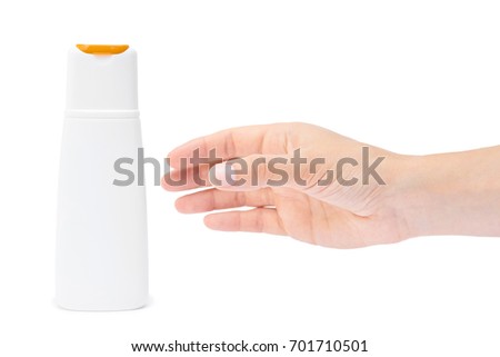 Hand holding shampoo bottle isolated on white background.