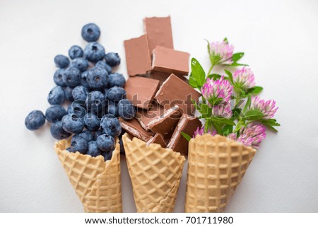 blueberry and chocolate
 in the ice cream cone