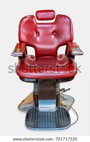 old Vintage barber chair (barber shop) isolated on white background.