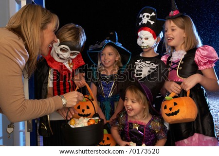 Happy Halloween party with children trick or treating Royalty-Free Stock Photo #70173520