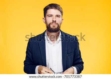 Business man on a yellow background.