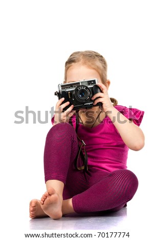 Beautiful girl  playing a photographer isolated on white