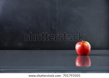 Autumn school table against a black background