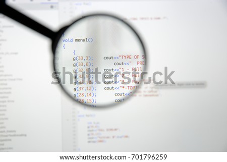 Real c / c++ code developing screen. Programing workflow abstract algorithm concept. Lines of c / c++ code visible under magnifying lens.