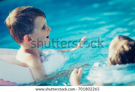 Picture of little kids enjoying in swimming pool